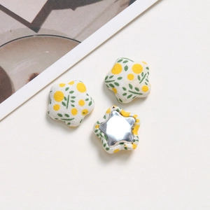 Floral fabric covered star-shaped buttons with silver metal backing for DIY hair accessories