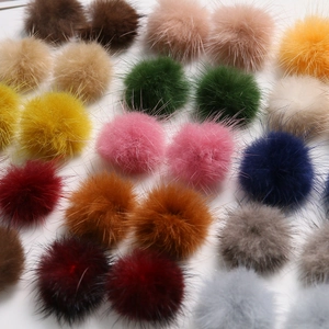 Flat lay of colorful 3.5cm mink fur pom poms for DIY hair accessories and craft jewelry