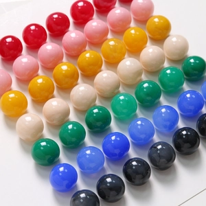Macro shot of 20mm colorful resin beads with ink-wash texture for jewelry making