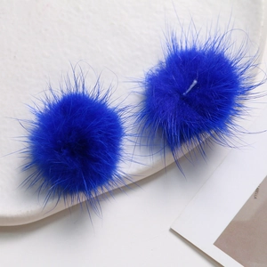 Close-up of royal blue mink fur balls for DIY jewelry and clothing accessories