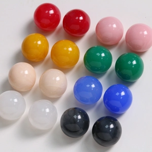 Macro detail of 20mm assorted ink-wash resin round beads for DIY earring jewelry making