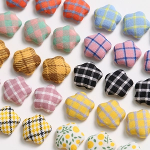 Colorful plaid and floral star-shaped fabric patches for DIY hair accessories and crafts
