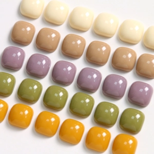 Macro detail of 10mm glossy square resin charms in Morandi colors for DIY jewelry making