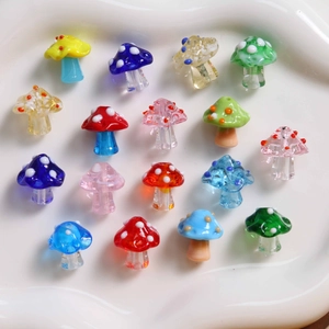 Close-up of colorful polka dot glass mushroom beads for DIY jewelry making and crafts
