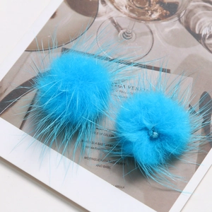 Detailed view of bright blue 3.5cm fluffy mink fur balls for DIY hair accessories