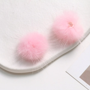Macro shot of fluffy 3.5cm pink mink fur balls for DIY craft jewelry and accessories
