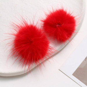 Macro shot of 3.5cm vibrant red mink fur balls for DIY jewelry and hair accessories