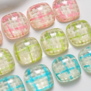 Macro view of colorful resin square patches with woven texture for DIY phone case jewelry