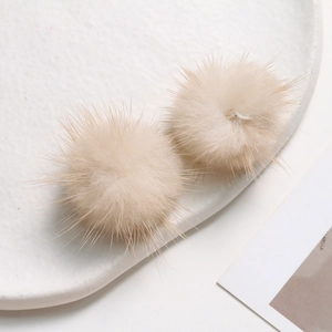Detail view of 3.5cm beige mink fur balls for DIY jewelry and hair accessories craft