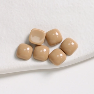 Macro shot of 6 khaki resin square cabochons with glossy finish for jewelry DIY