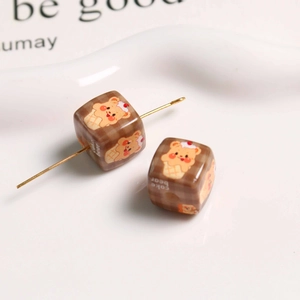 Macro view of vintage brown checkered square bear acrylic beads for jewelry making