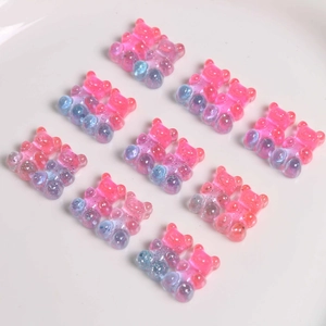 Macro detail of gradient resin gummy bears with glitter for DIY jewelry and hair accessories