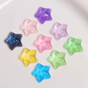 Top view of colorful starry resin star charms with glitter for DIY jewelry making