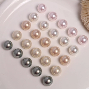 Mix of 8-10mm colorful pearlescent round pearls for jewelry making on ceramic tray