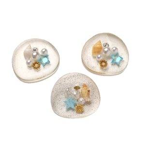 Three sea-inspired resin charms with shells and pearls for DIY accessories
