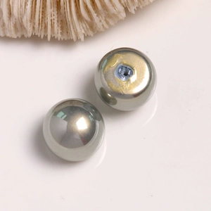 Macro view of metallic grey pearl beads with high gloss finish and pre-drilled holes