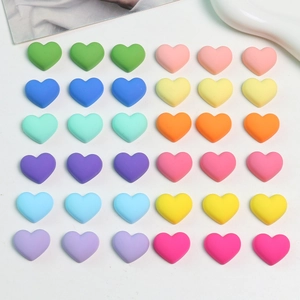 Colorful macaron matte acrylic heart charms for DIY jewelry making neatly arranged on white