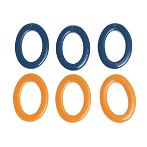 Flat lay of oval resin pendant charms in navy blue and orange colors for DIY jewelry making