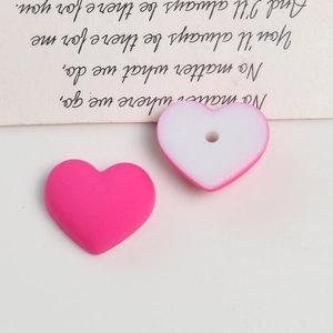 Macro shot of macaron matte acrylic heart beads for DIY jewelry making accessories