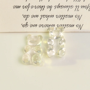 Close-up of transparent resin gummy bear charms for DIY jewelry and accessories