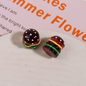 Macro detail of high-quality resin hamburger charms with layered colors for DIY jewelry