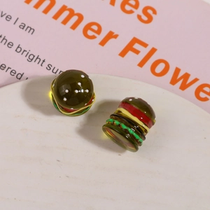 Detailed macro view of 3D resin miniature burgers for DIY crafts and earring making