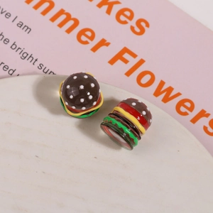 Macro shot of 3D resin mini burger charms for DIY jewelry and hair accessories craft