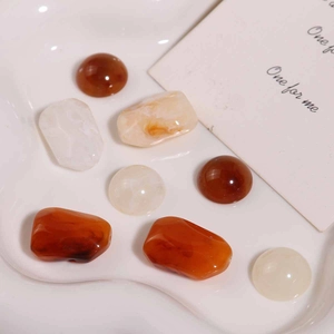 Vintage irregular resin beads with marble pattern for DIY jewelry making on white ceramic plate