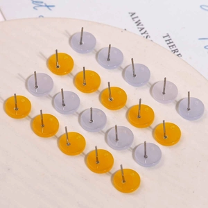 Minimalist jelly colored acrylic round stud earrings in yellow and light purple colors