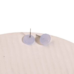 Minimalist jelly lavender round acrylic stud earrings on a white ceramic tray