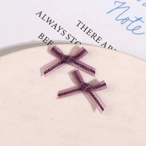 Close-up of purple organza mesh bowknot DIY accessories for handmade hairpins and nails