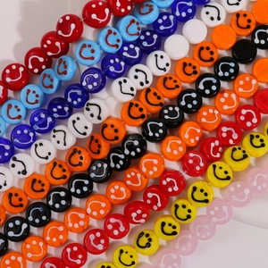 Detailed view of 14mm colorful smiley face glass beads for DIY jewelry making