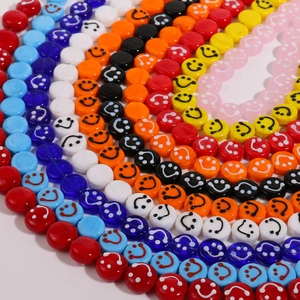 Vibrant 14mm round glass smiley face beads in a colorful circular pattern for DIY jewelry
