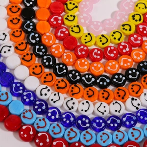 Macro shot of colorful 14mm round smile face beads for DIY jewelry making crafts