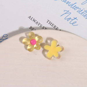 Detail of glitter resin flower charms for DIY hair clips with pink bead centers