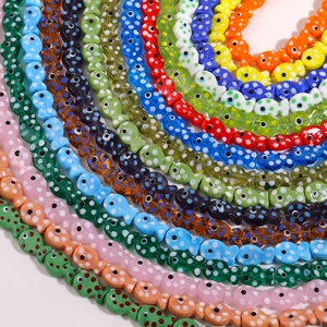 Macro shot of colorful polka dot ceramic fish beads for DIY handmade jewelry crafting