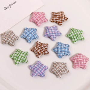 Close-up of star-shaped fabric patches with houndstooth patterns in assorted colors