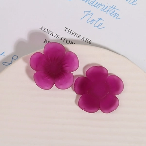 Detailed macro view of matte dark purple resin sunflower petals for DIY jewelry crafts