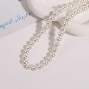 Vue détaillée de perles de verre rondes de 10 mm blanc brillant pour bijoux DIY