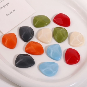 Colorful irregular resin DIY accessory pieces with textured surface in diverse colors