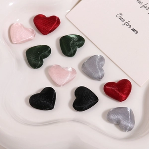 Assorted satin fabric heart-shaped buttons in red pink green and black colors