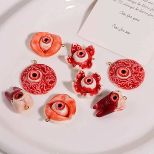 Detailed view of Halloween eyeball pendants with realistic bloodshot resin details