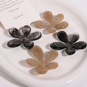Ink marble flower resin hair accessories in amber and grey smoke patterns