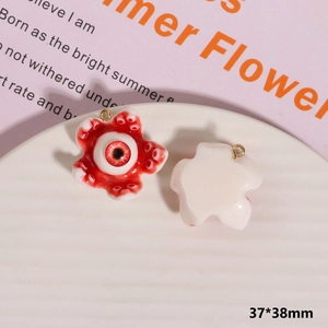 Macro detail of scary monster eyeball pendant showing realistic 3D resin texture and size