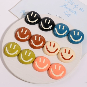 Set of ten colorful resin smiley face charms for DIY hair clips and phone case accessories