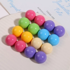 Polished Morandi color resin round beads in a white bowl for DIY earring jewelry making