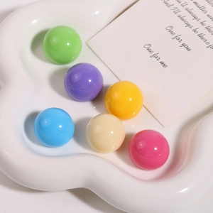 Close-up of vibrant Morandi-colored resin spherical beads for DIY jewelry making