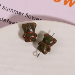Detail of vintage bear glass beads with silver pins for DIY jewelry making