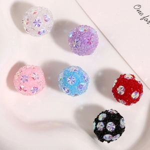 Macro detail of six colorful sparkling beads with star sequins for DIY jewelry making