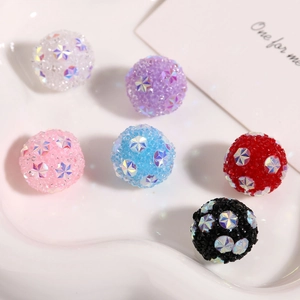 Macro detail of colorful Shamballa beads with rhinestones and star sequins for DIY jewelry